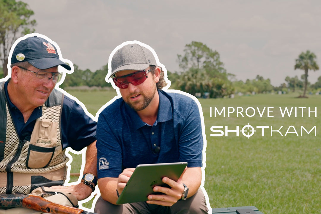 Shooting tips in Europe: Experienced marksmen using ShotKam footage on a tablet to improve their shooting techniques.