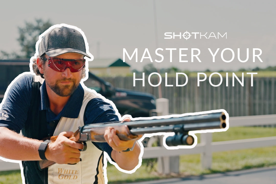 Mastering hold points in Europe: World champion shooter showcasing techniques with a ShotKam on a shotgun.