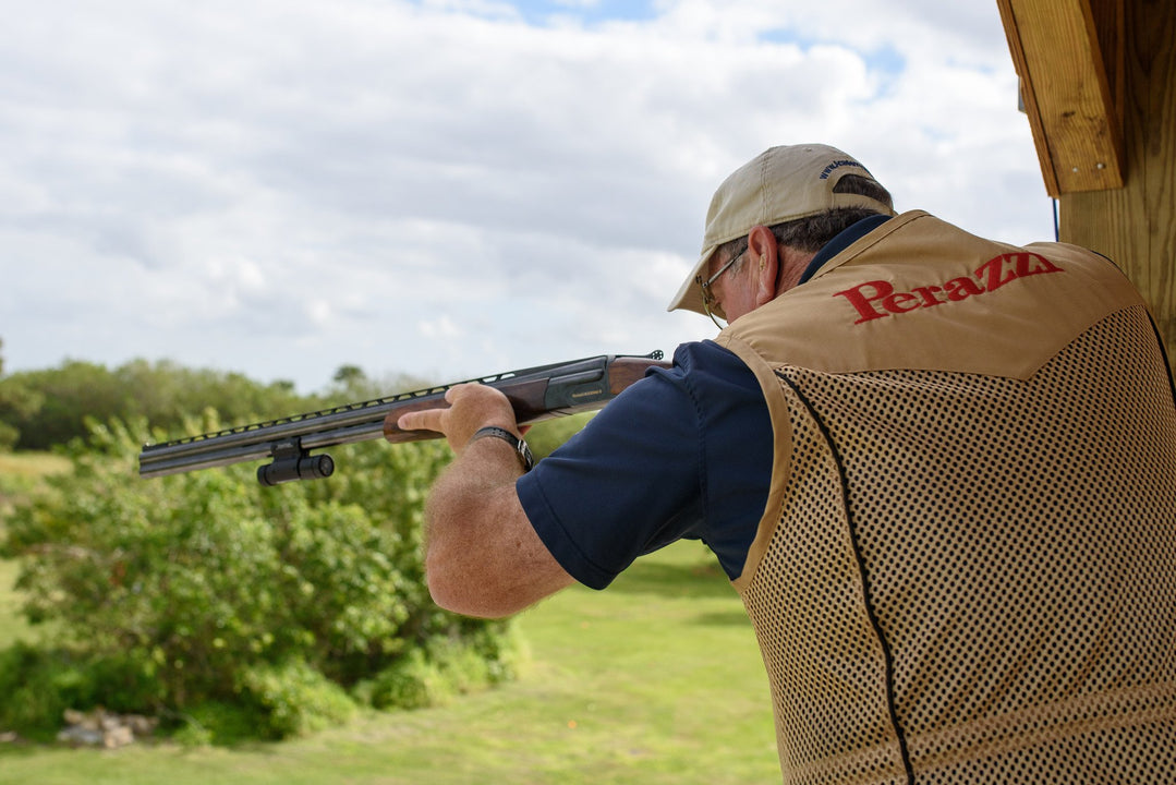 European shooter taking aim during a sporting clays session, demonstrating strategies for hitting rabbit targets.
