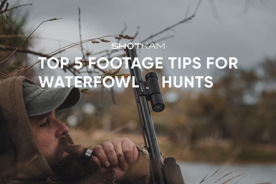 ShotKam mounted on a shotgun as a waterfowl hunter tracks birds over marshland