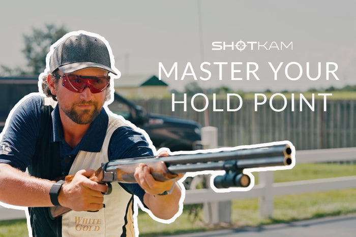 Mastering hold points in Europe: World champion shooter showcasing techniques with a ShotKam on a shotgun.