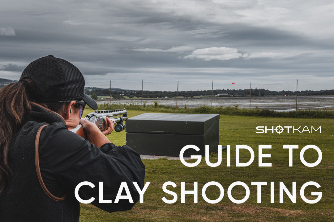 Clay shooter tracking a flying target with a ShotKam-equipped shotgun
