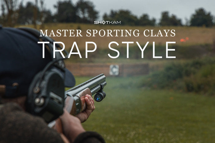 Close-up of a ShotKam camera capturing a trap-style clay shot on a European sporting clays range.
