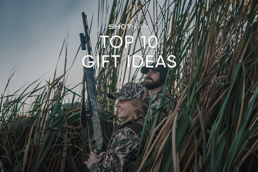 Outdoor-loving couple in camouflage gear hunting in Europe, highlighted in ShotKam’s top 10 Valentine’s gift ideas for nature enthusiasts.