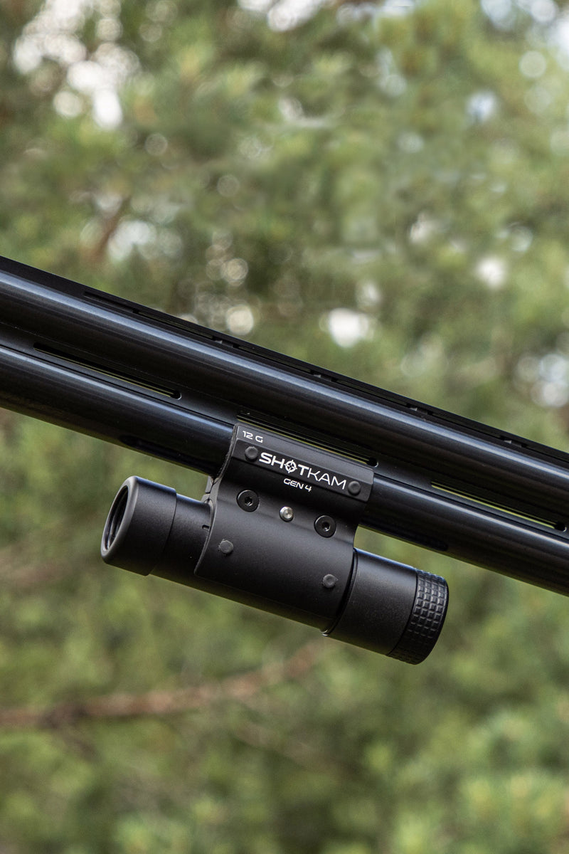 ShotKam Gen 4 mounted to a over and under shotgun barrel to capture 4k video of sporting clays and trap shooting